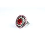 A large silver CZ and garnet dress ring