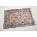 Indian Silk Kashmir Rug decorated with a central cartouche and a dense floral pattern within a