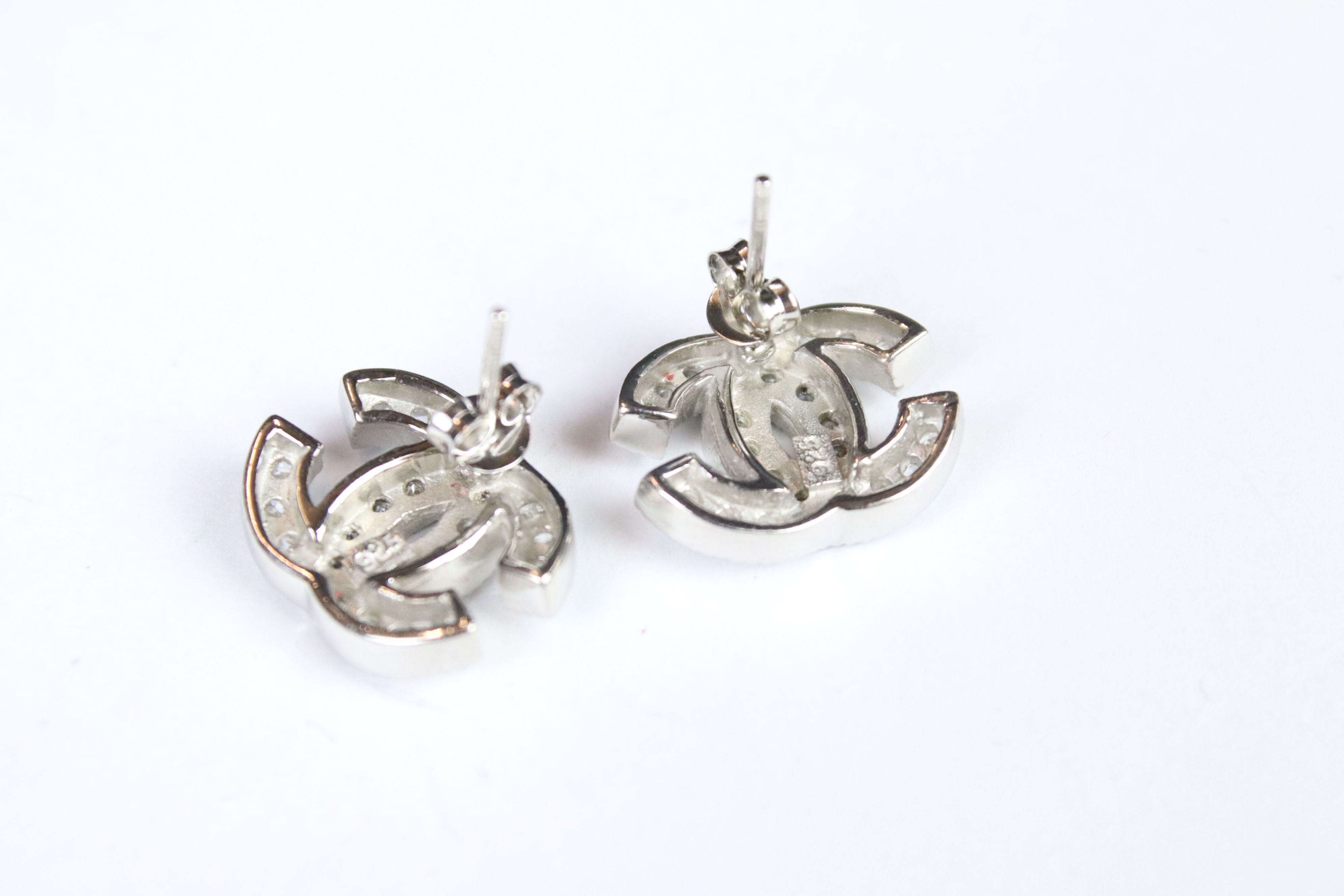 A pair of silver and CZ designer style stud earrings. - Image 2 of 3