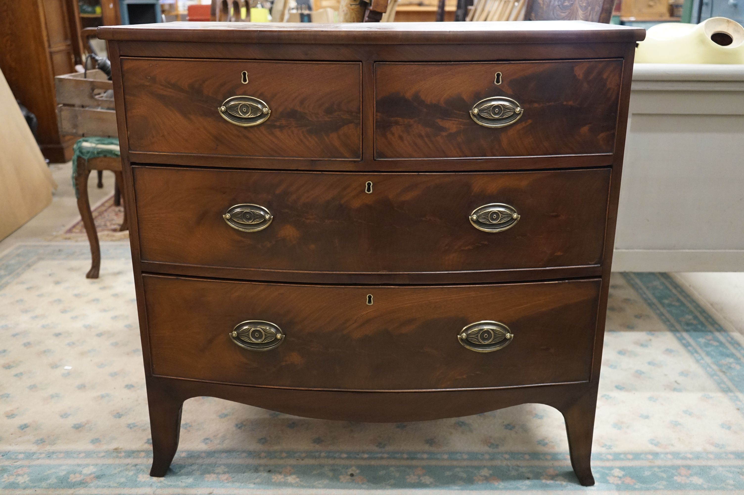 A 19th century mahogany bow front chest of 2 short and 2 long drawers of small proportions.