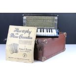 A vintage Estrella piano accordion complete with instruction book and original case.