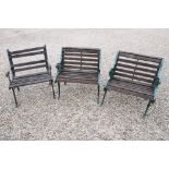 Group of three wooden garden benches with cast iron supports, each approx 70cm wide