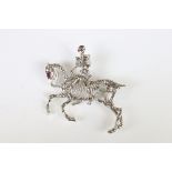 An interesting silver brooch in the form of a skeleton rider and horse.