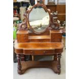 Victorian Mahogany Duchess Dressing Table, the upper section with oval mirror held on carved