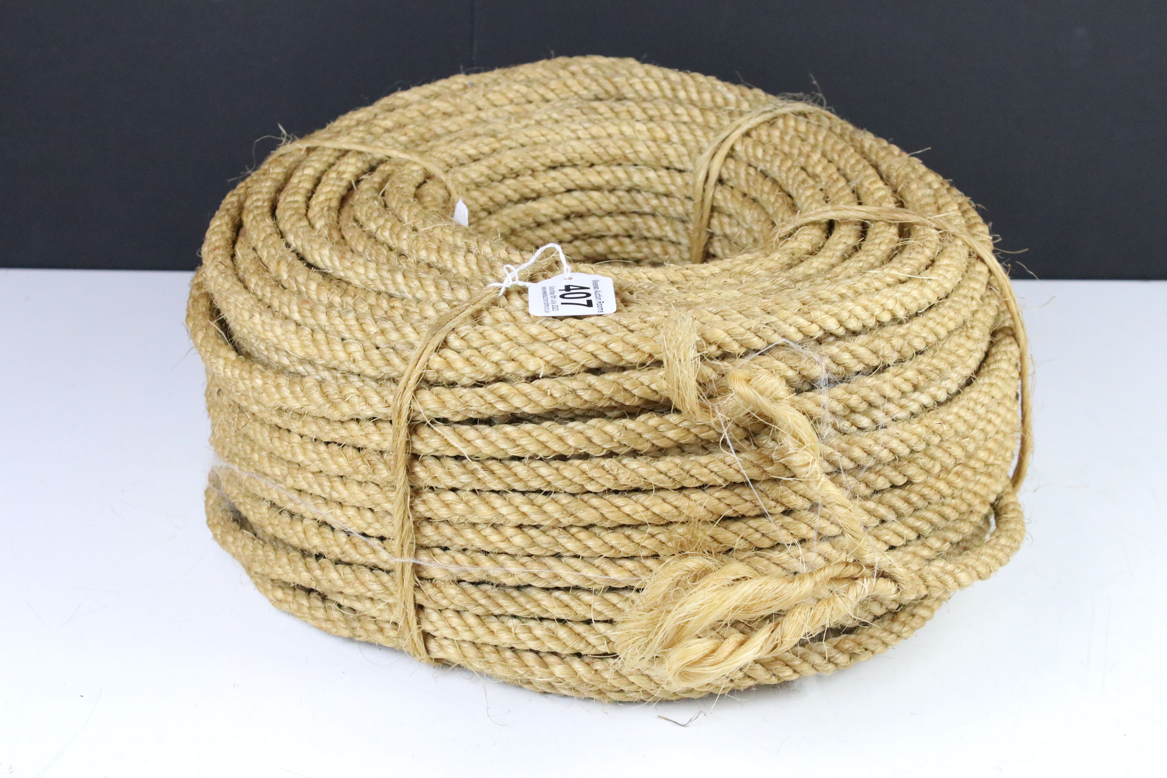 A vintage ball of brown string together with a roll of rope. - Image 2 of 3