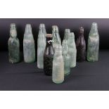 A collection of antique advertising bottles to include Aldershot and Bristol examples.