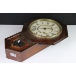 A vintage wooden cased wall clock, the dial marked 'Seth Thomas'.