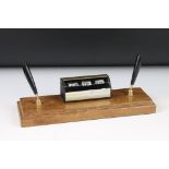 Mid century Desk Stand comprising perpetual calendar and two pens holders, mounted on a wooden