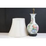 20th Century Chinese Famille Rose baluster vase converted to a table lamp, decorated with flowers,