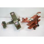 A tinplate model of the Red Baron's Fokker trio plane, finish in red with iron cross insignia