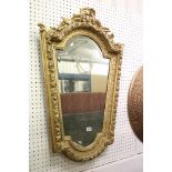 19th century Italian style shaped Wall Mirror held with a Floral Carved Giltwood and Gesso Frame,