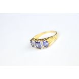 A tanzanite and diamond ring set in silver gilt.