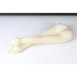 Plaster wall plaque modelled as a pair of lady's legs wearing stockings and high-heeled shoes,