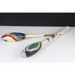 A pair of hand painted exercise batons / Indian clubs.