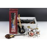 A collection of ornamental miniature musical instruments to include Gretsch and Fender electric