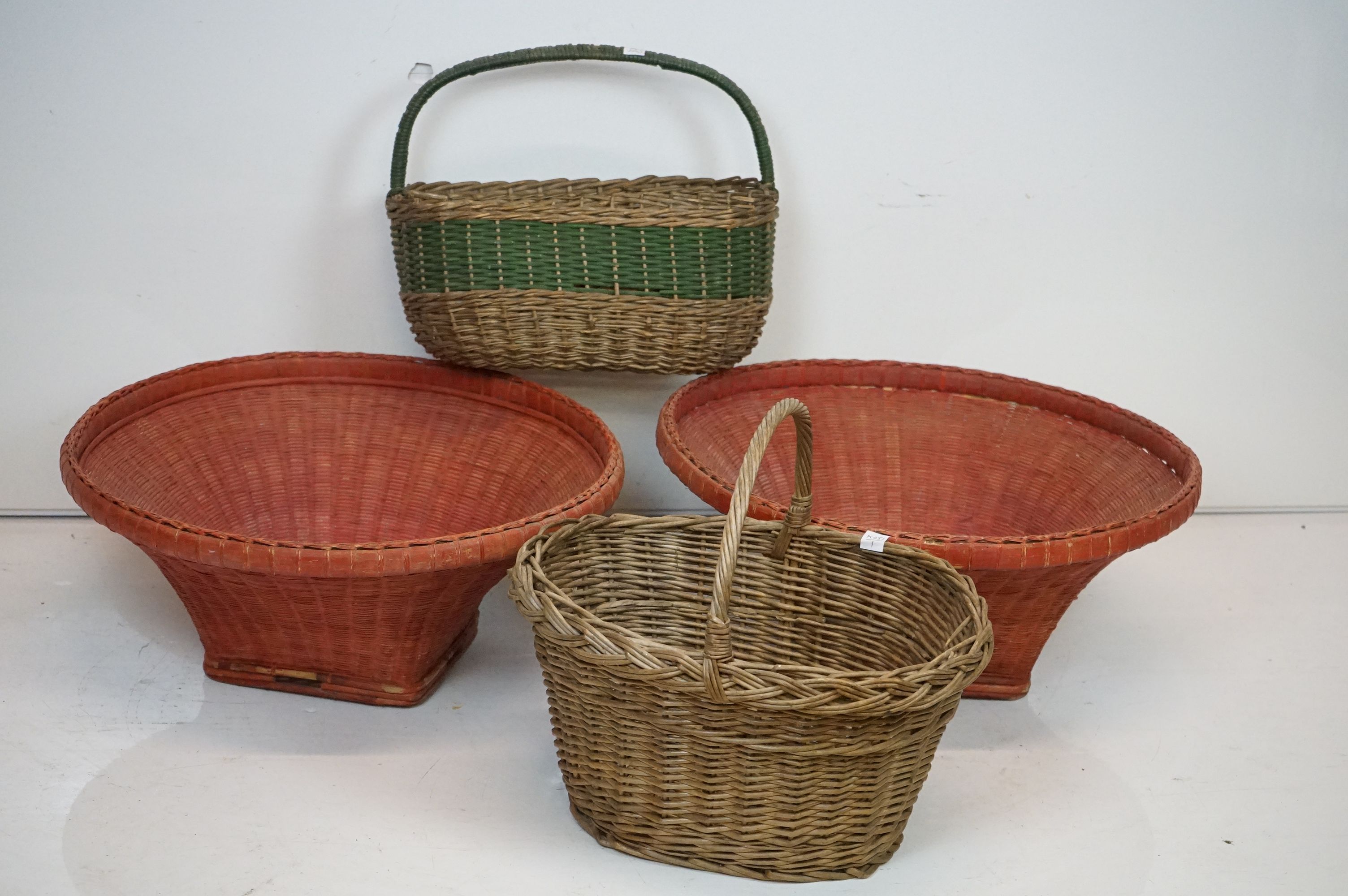 A collection of 4 vintage wicker baskets.