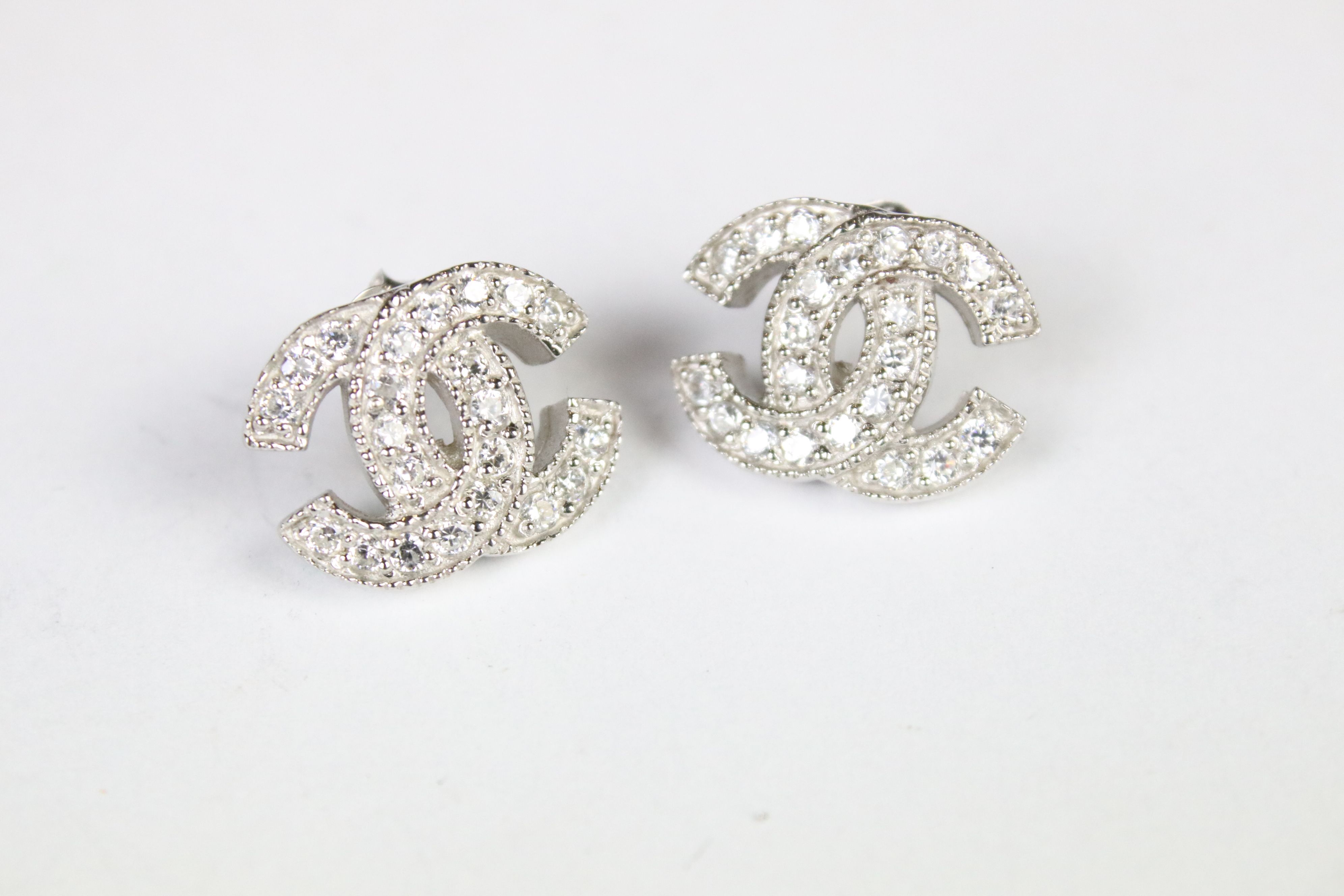 A pair of silver and CZ designer style stud earrings. - Image 3 of 3