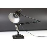 A mid 20th century Herbert Terry black 'Anglepoise' lamp with two step base.