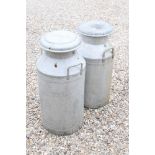 Two metal milk churns to include Express Dairy and Unigate Dairy examples