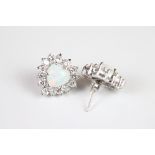 A pair of silver CZ and opal panelled stud earrings.