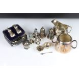 A mixed collection of silver and silver plated items to include cruets, salts, cream jug...etc.