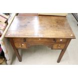 George III Oak Lowboy or Side Table, with an arrangement of three drawers and shaped apron, raised