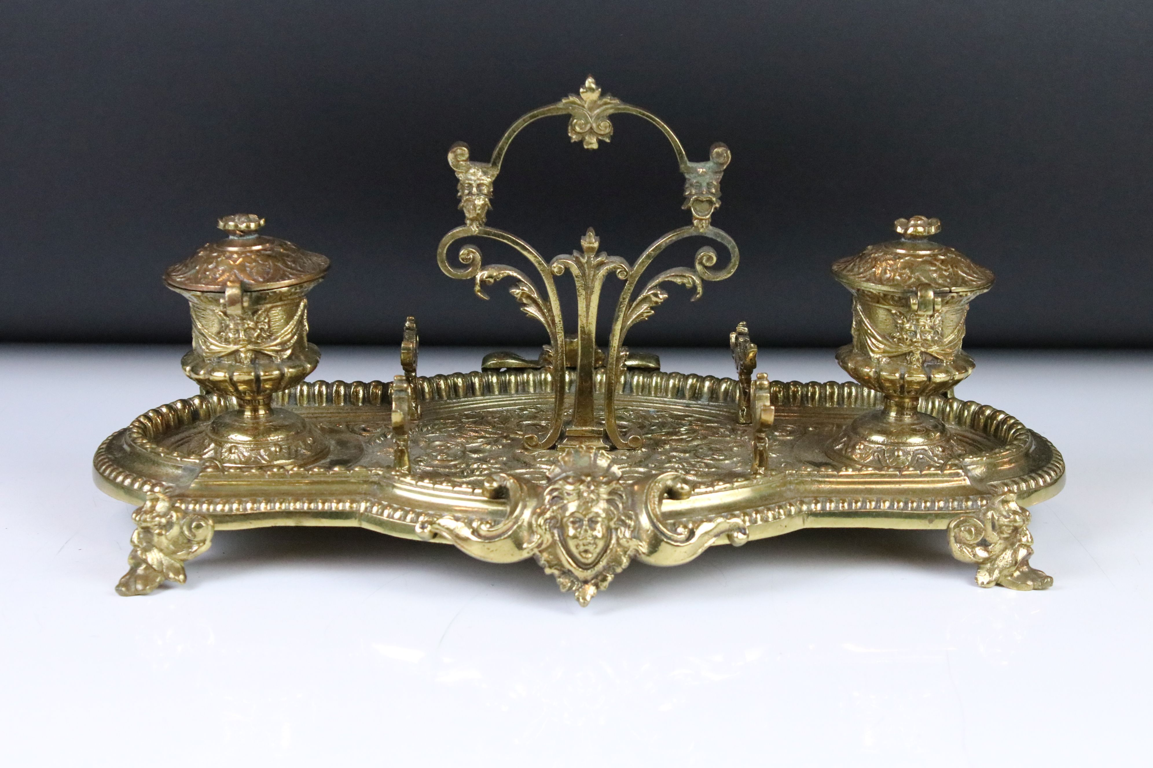 Brass standish with cast Gothic decoration, twin inkwells with glass liners (one matched), pen rests - Image 3 of 5