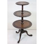 A 19th century walnut three tier dumb waiter