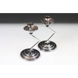 Pair of Art Deco Chromium Candlesticks with angular column supports and circular stepped bases, 18cm