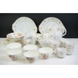 19th Century white ground & gilt tea set (teapot & cover, 7 teacups, 4 saucers, 5 tea plates, milk