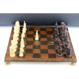 A Wellington & Napoleon hand painted chess set together with chess board.