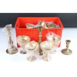 A collection of brassware to include goblets, candlesticks...etc.