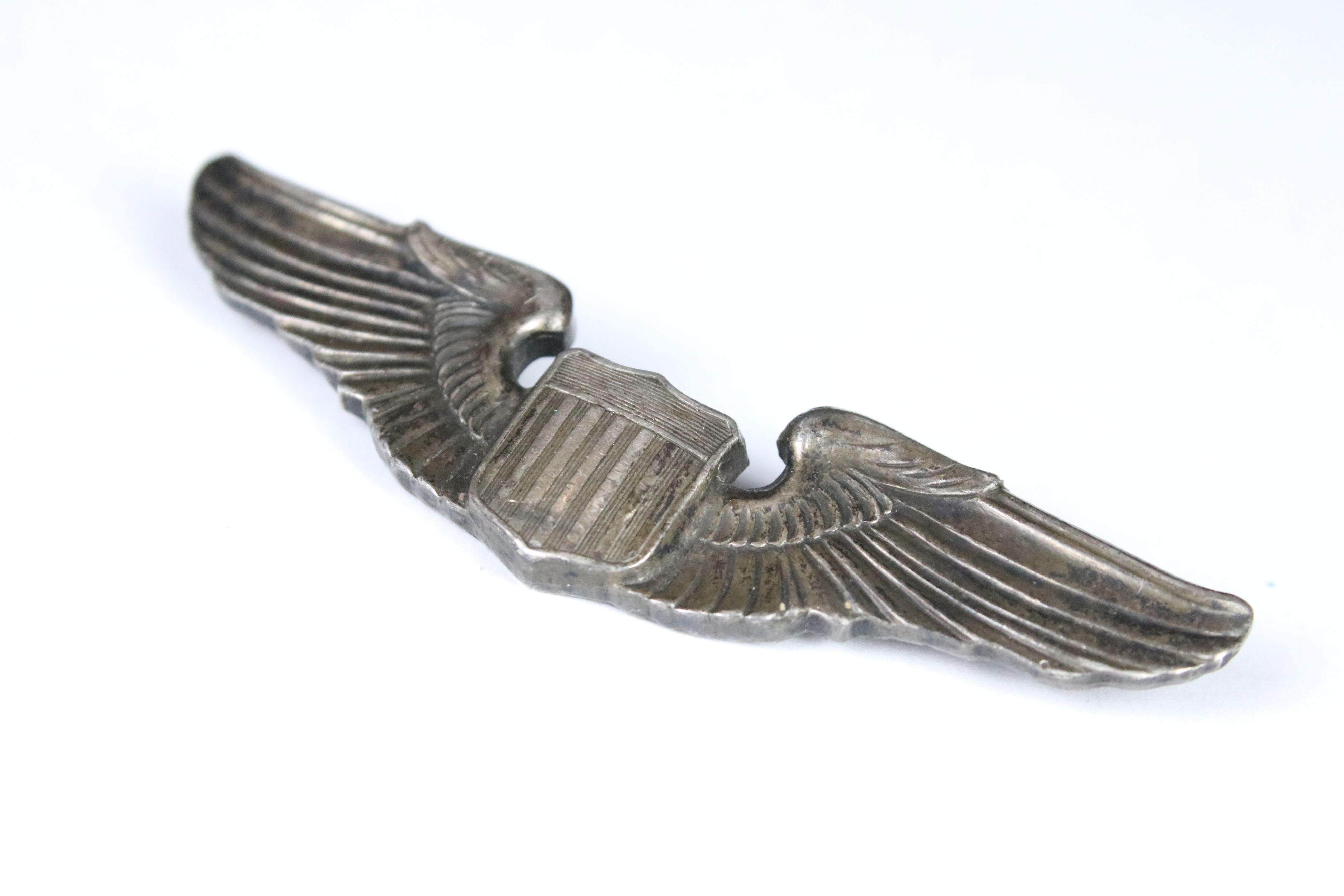 A WWII United States Air Force wings badge, stamped Sterling