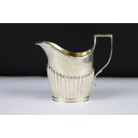 A fully hallmarked sterling silver cream jug, assay marked for London.