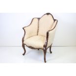 19th century style French Bergere Armchair, the walnut frame carved with flowers and acanthus leaves