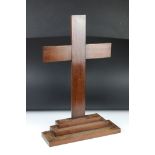 Wooden cross mounted on a stepped base, 59cm high