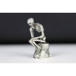 An unusual seated skeleton vesta case.