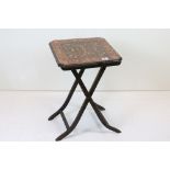 19th century Folding Table, the square top decorated with acorns, fruits and foliage, raised on