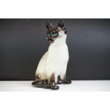 Winstanley pottery model of a Seated Siamese Cat, with blue glass eyes, signed ' Kensington 32