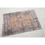 Indian Silk Kashmir Rug decorated with a central cartouche and a dense floral pattern within a