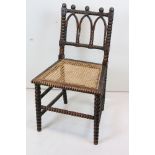 19th century Gothic Revival Side Chair with carved bobbin supports and cane seat (seat a/f), 49cm