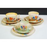 Three Clarice Cliff 'Crocus' pattern trios to include a Wilkinson Pottery 'Bizarre' trio, Royal