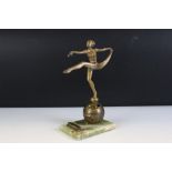 Art Deco gilt metal table lighter in the form of a semi-nude lady dancer raised upon a globe,