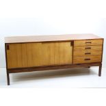 Mid century Retro Teak Sideboard comprising a bank of four drawers and two sliding cupboard doors,