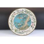 Chinese cloisonne charger with central blue ground panel depicting a bird mid-flight, floral border,