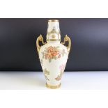 Victorian Royal Worcester twin handled ivory blush vase with gilt and floral detailing. Puce mark to