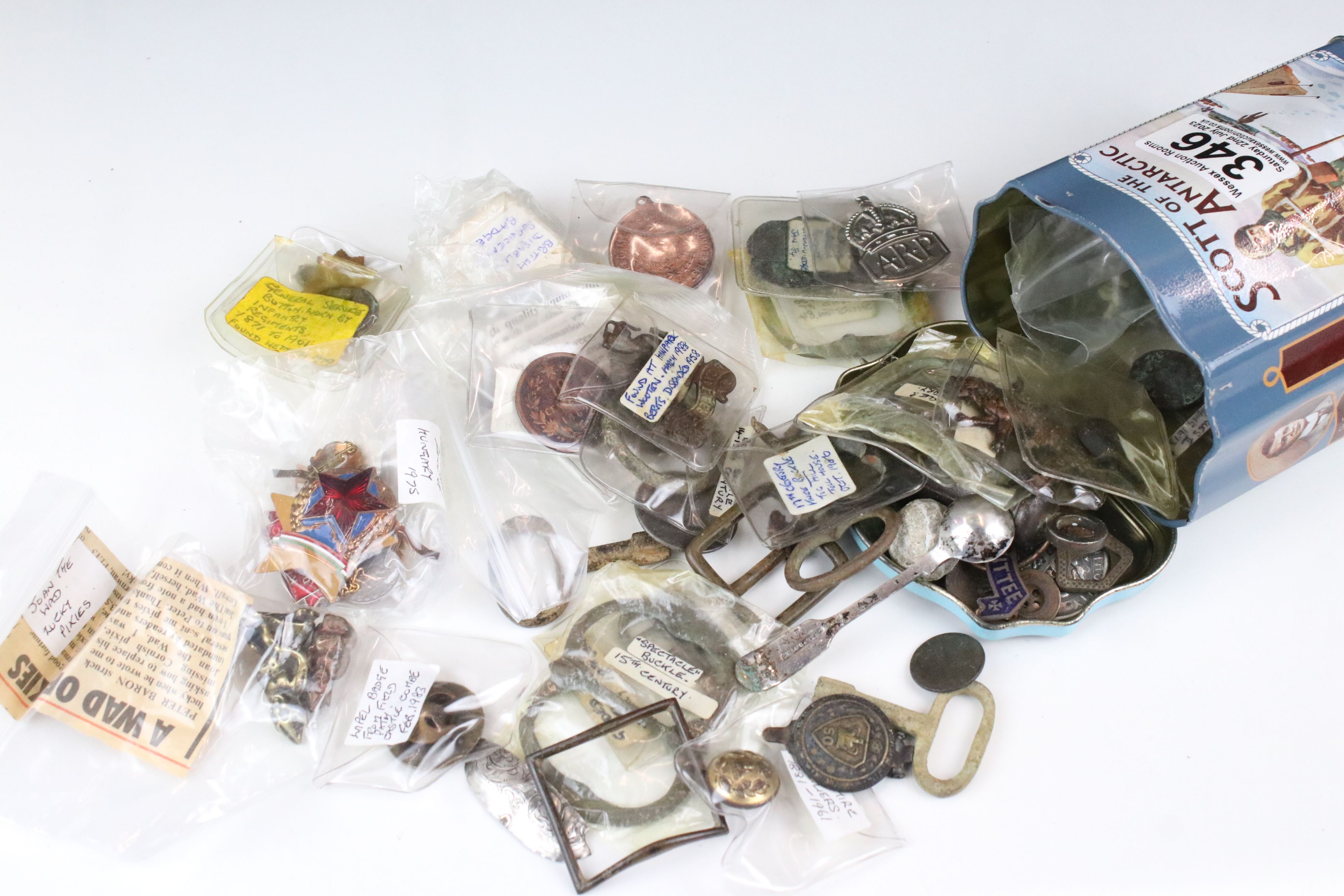 A box of mixed collectables to include whistle, military badges and buttons, coins, musket balls,