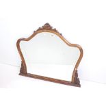 Late 19th / Early 20th century Scrolling Carved Walnut Framed Shaped Overmantle Mirror, 87cm high