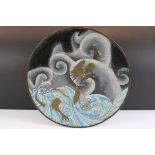 Chinese cloisonne charger decorated with a dragon amongst waves and clouds, floral decoration on