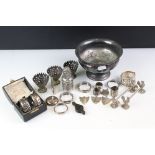A collection of mixed sterling silver and silver plated collectables to include napkin rings,